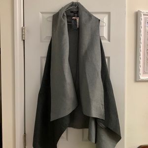 One size fits all. Brand new gray vest.